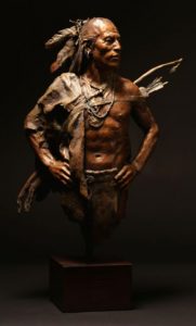 John Coleman Unvanquished Native American man bronze sculpture Briscoe Museum