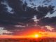 Jessica Garrett blinding beauty landscape glowy sky moody clouds oil painting