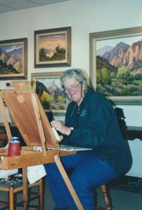 cynthia rigden artist at easel oil painting western art