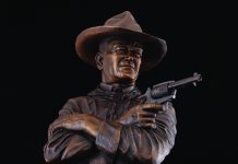 Michael Trcic Out Here A Man Solves His Own Problems John Wayne cowboy pistol firearm gun western bronze sculpture close up