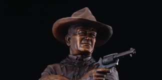 Michael Trcic Out Here A Man Solves His Own Problems John Wayne cowboy pistol firearm gun western bronze sculpture close up