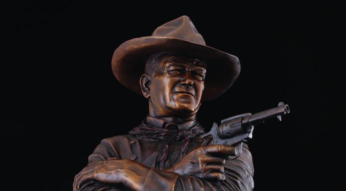 “Out Here A Man Settles His Own Problems” Michael Trcic Michael Trcic Out Here A Man Solves His Own Problems John Wayne cowboy pistol firearm gun western bronze sculpture close up